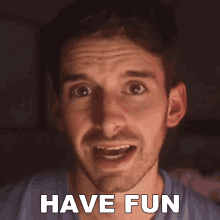 a man with a beard is making a face with the words have fun behind him