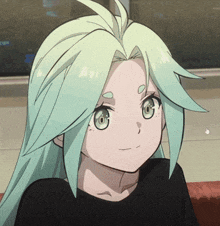 a girl with green hair is wearing a black shirt and smiling