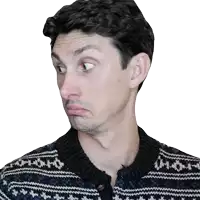 a man wearing a blue and white sweater is making a face