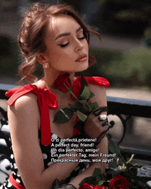 a woman in a red dress holds a red rose in her right hand