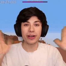 a man wearing headphones with the number 38/25,000 on the top