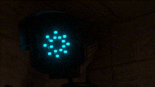 a dark room with a glowing blue circle in the center
