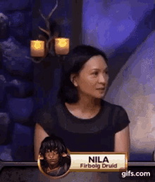 a woman with a name tag that says nila firbog druid