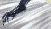 a close up of a person 's hand with a claw on it