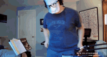 a man wearing a mask and a shirt that says ' south main '