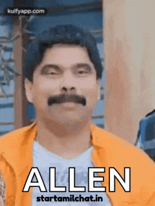 a man with a mustache is wearing an orange shirt and has the word allen on his face .