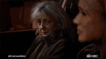 a woman in a car with #chicagomed written on the bottom right