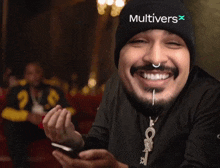 a man wearing a black beanie with the word multivers on it