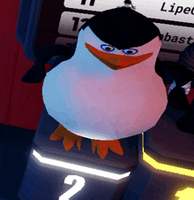 a penguin is sitting on a podium with the number 2 in the background