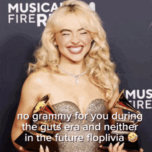 a picture of a woman holding a grammy with a caption that says no grammy for you