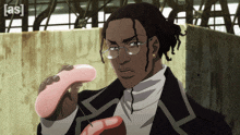 a man with glasses is holding a pink object with the letters eas on the bottom right