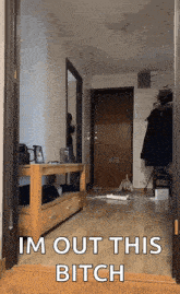 a picture of a hallway with the words im out this bitch written on it