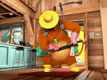 a bear in a yellow hat and yellow boots holds a gun