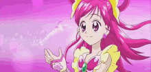 a girl with pink hair and a yellow headband is holding a pink object in her hands .