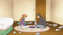 a boy and a girl are sitting on the floor in a room