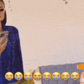 a woman wearing sunglasses is holding a cell phone with tears coming out of her eyes behind her
