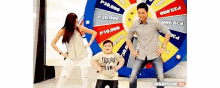 a man and a woman are dancing in front of a spinning wheel that says p28,000