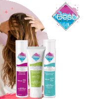 a woman holds her hair in front of bottles of best products