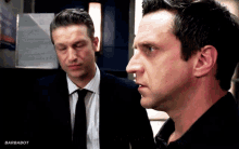 two men in suits and ties are looking at each other with barbabot written in the corner