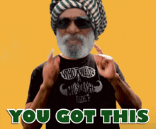 a man with a beard wearing sunglasses and a shirt that says " who wants a commoche ride ? "