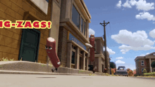 two sausages are running down a street in front of a building that says ' g-zags '