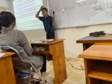 a man is giving a presentation in front of a white board that says " the best way to learn "