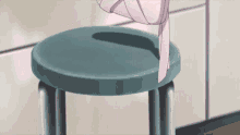 a person is standing on a stool with a pink scarf around their neck