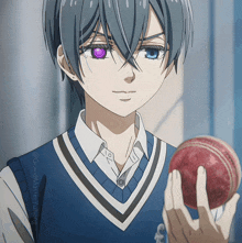 a boy with purple eyes is holding a red ball in his hand