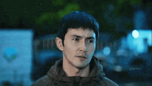 a close up of a man 's face with the letters yan on the bottom