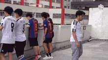 a group of soccer players one of whom has the number 8 on his jersey