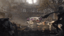 a purple car is sitting in a pile of rubble in front of a building that says nup