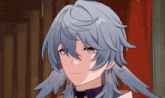 a close up of a person 's face with long blue hair and earrings