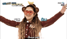 a woman wearing a monkey headband and red glasses says " great job "
