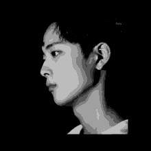 a black and white photo of a young man 's face with the word happy written below it