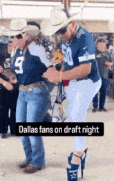 a man in a dallas jersey is dancing with a woman in cowboy boots .