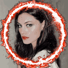 a woman 's face is surrounded by a red and white circle