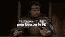 a man in armor is sitting in a chair with the words tentative n 347 pour booster le pe