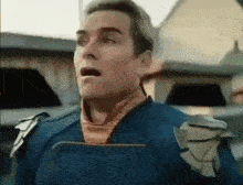 a man in a superhero costume with his mouth open