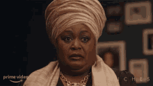 a woman wearing a turban and a necklace is on a prime video advertisement