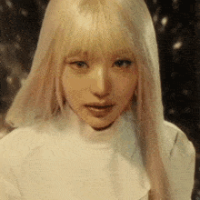 a woman with long blonde hair and bangs is wearing a white turtleneck .