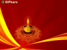 a candle is lit up on a red background with stars flying around it