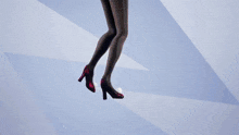 a woman in a red dress with bunny ears is standing with her arms outstretched