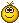 a pixel art smiley face with a crown on it .