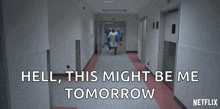 a woman in a hospital gown is walking down a hallway with the words " hell this might be me tomorrow " on the bottom