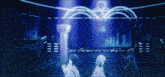 a group of girls are standing in front of a stage with a clover on it