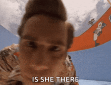 a close up of a person 's face with the words is she there written on the bottom .