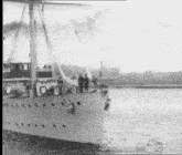 a black and white photo of a sailboat in the water