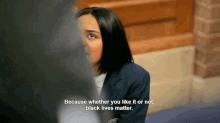 a woman in a school uniform says " because whether you like it or not, black lives matter "