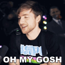 a man is wearing a shirt that says oh my gosh on it