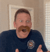 a man with a mustache is wearing a shirt that says fbc